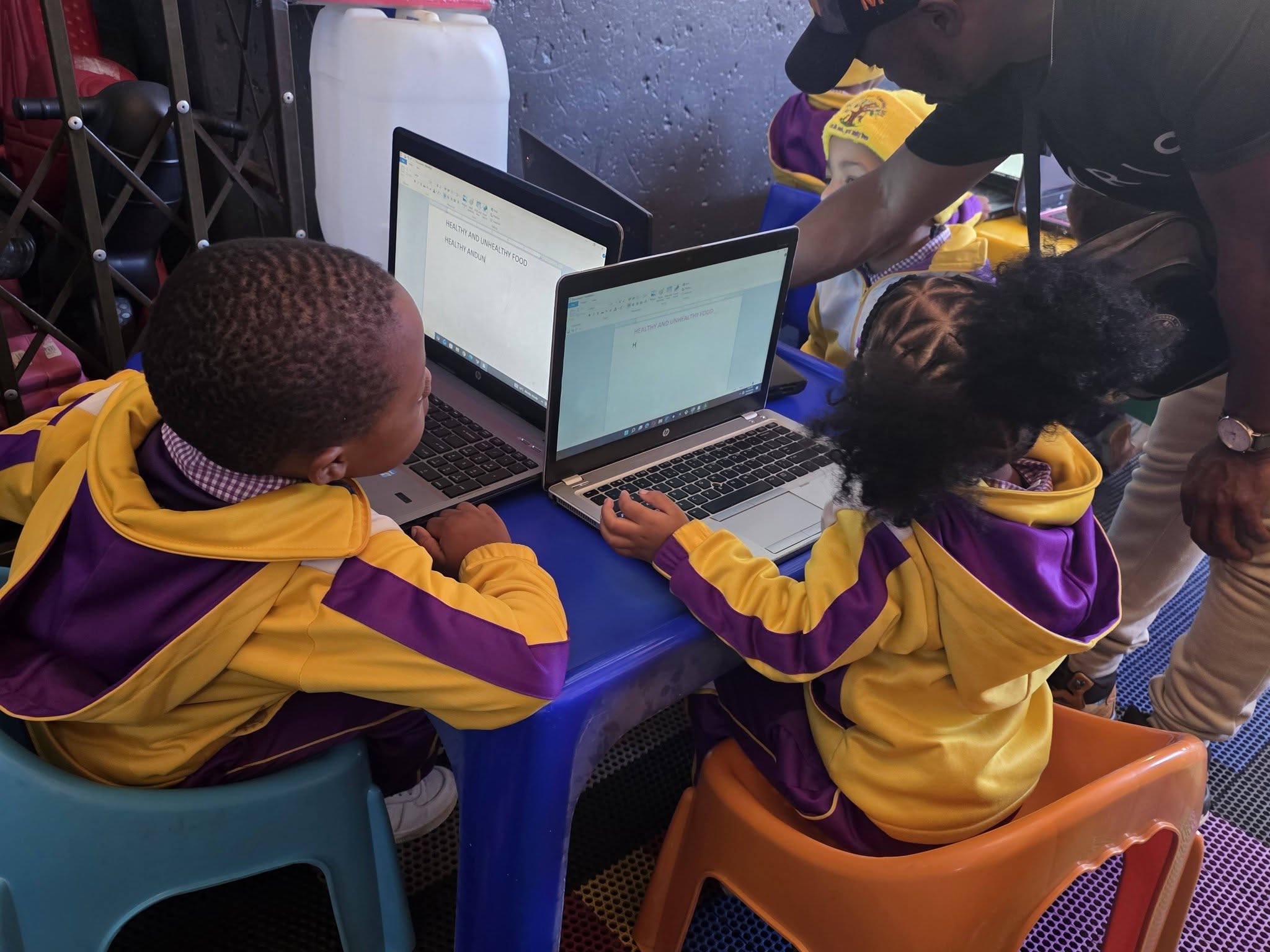Children learning computer literacy