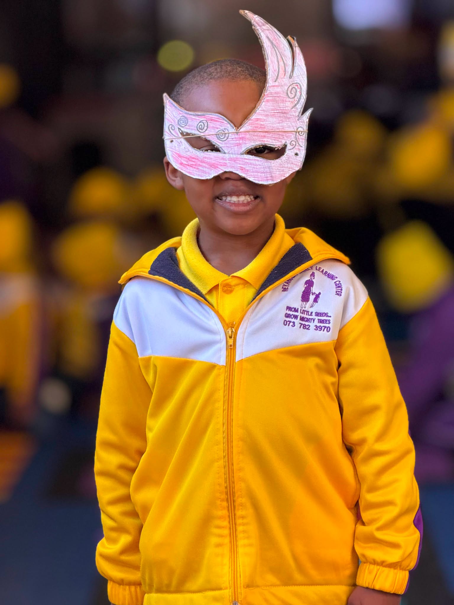 Children creating and wearing funny masks